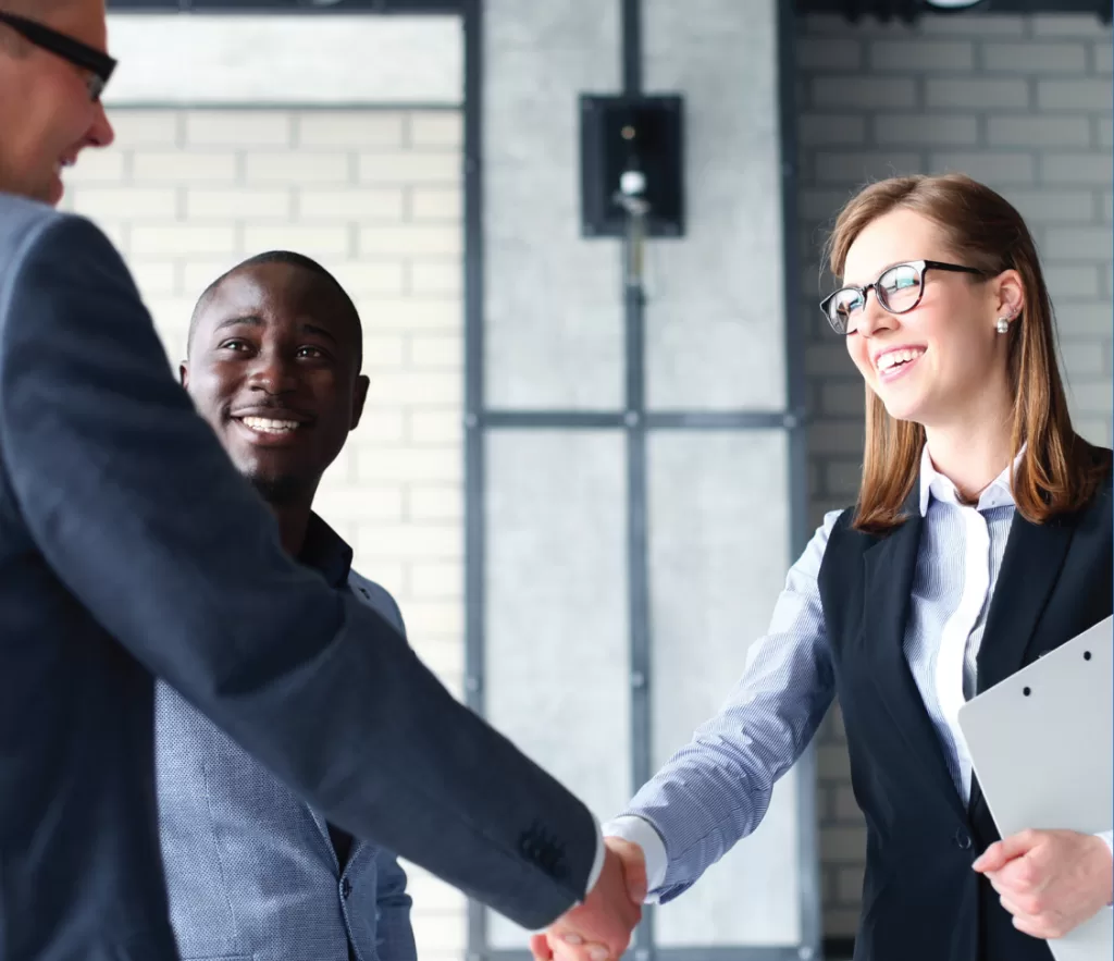 Team members shaking hands